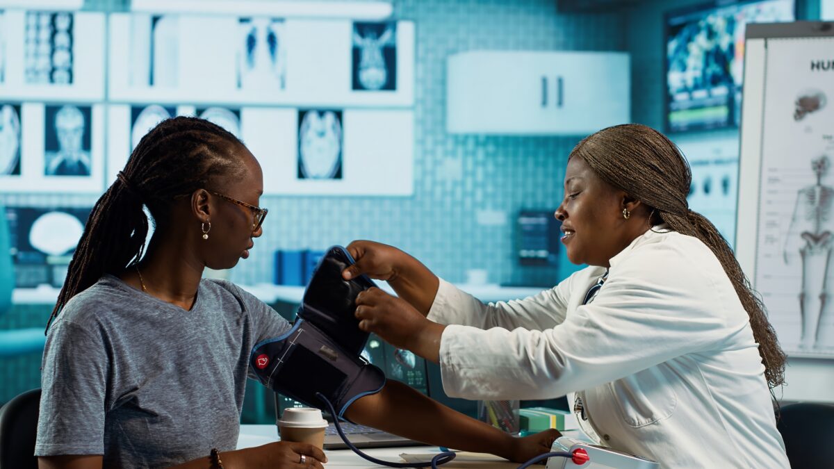 black-medic-practitioner-takes-blood-pressure-with-blood-pressure-monitor-1200x675.jpg